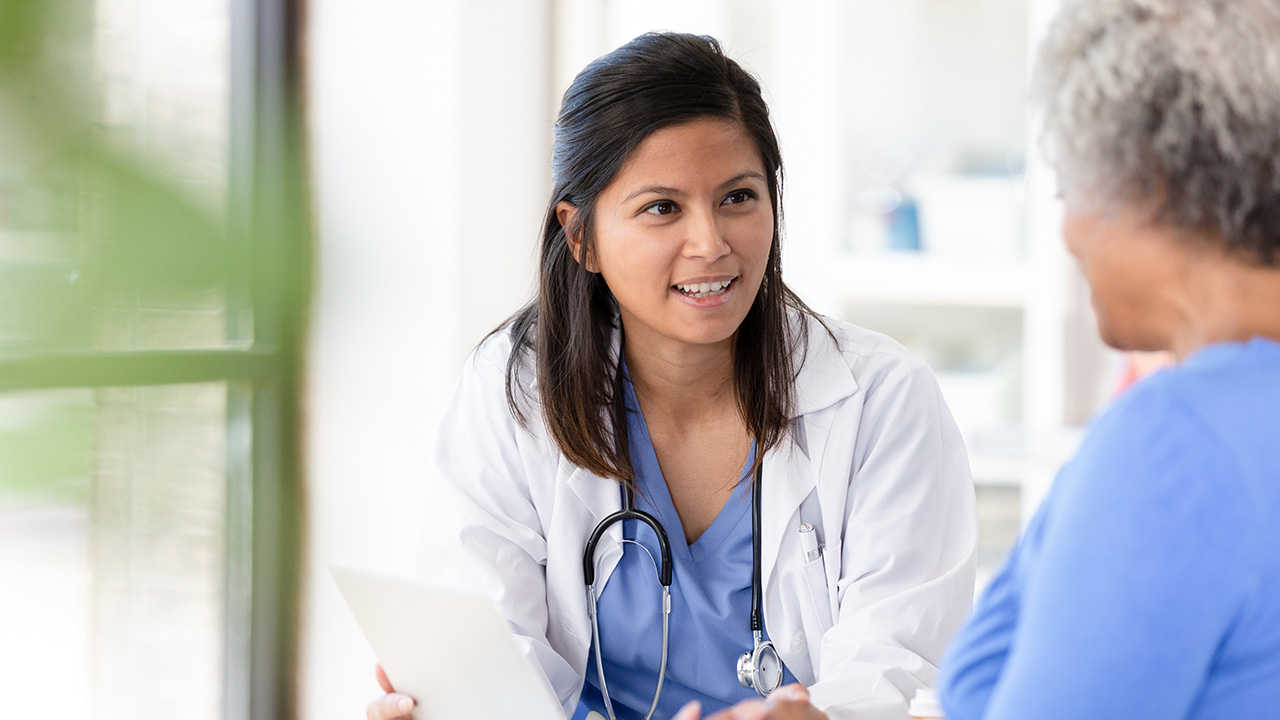 Doctor talking to her patient