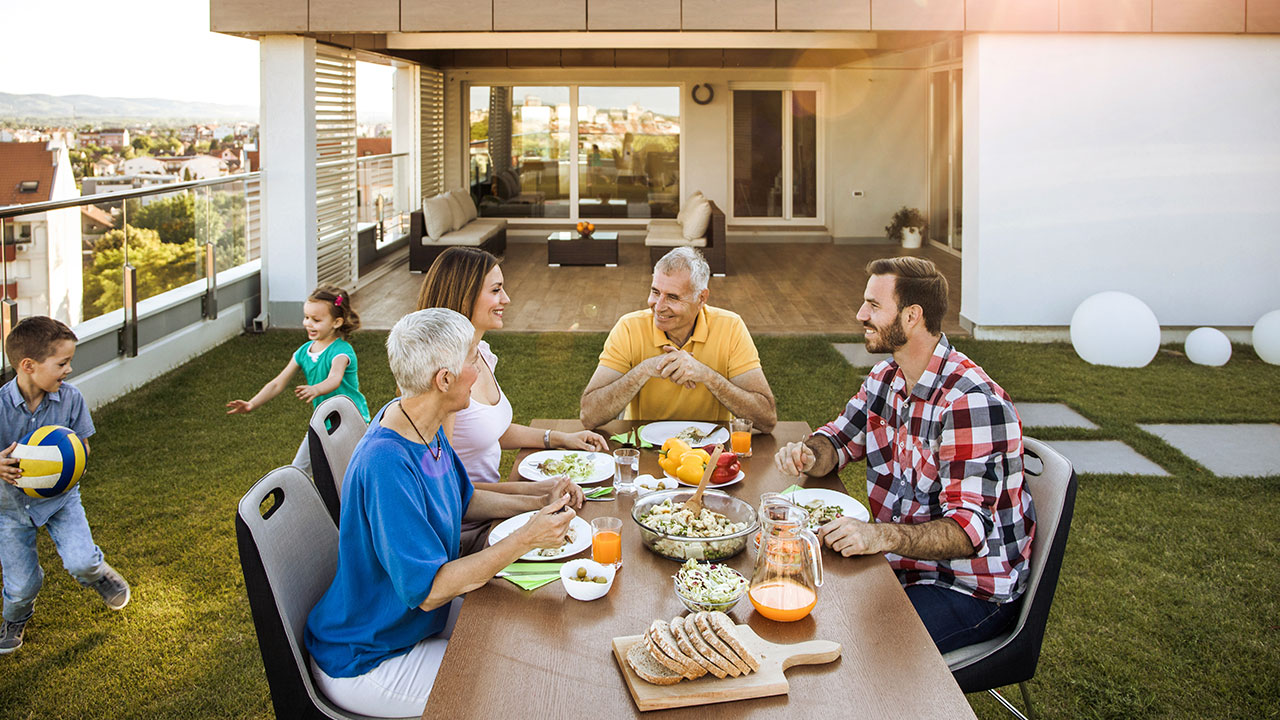 Family having lunch on their backyard